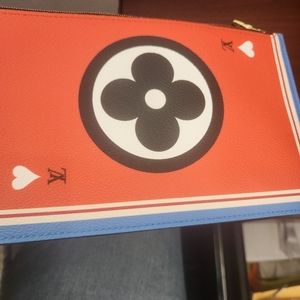 Luis Vuitton unlimited addition game wristlet .